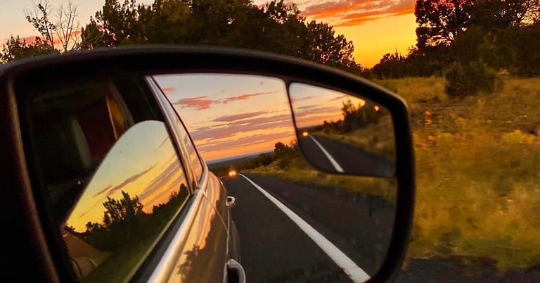 road-trip-sunset-rearview-mirror