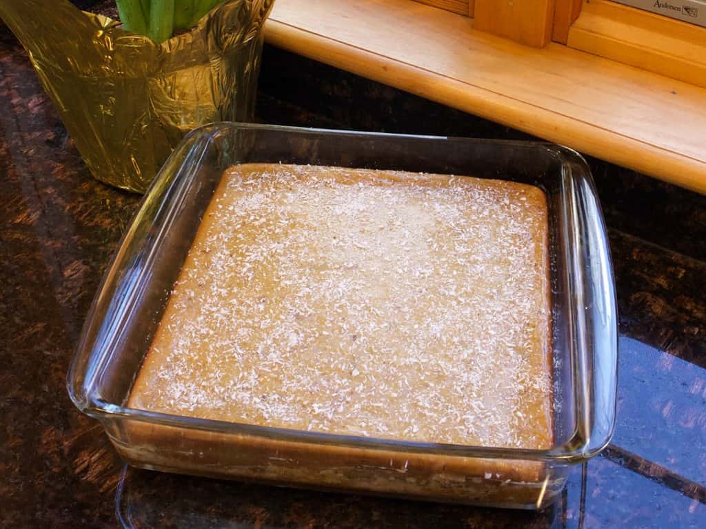 lemon zucchini cake in square pan on counter