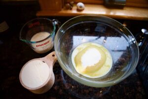 butter-sugar-large-bowl-flour-milk-measuring-cup-