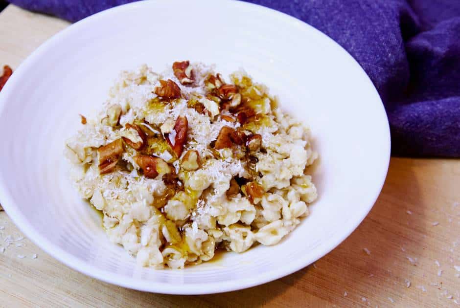 oatmeal-in-bowl-shredded-coconut-pecans-maple-syrup