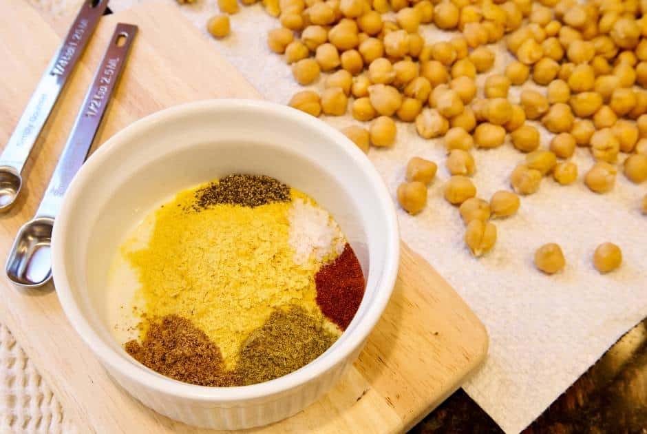 small-bowl-spices-garbanzo-beans-lying-on-towel