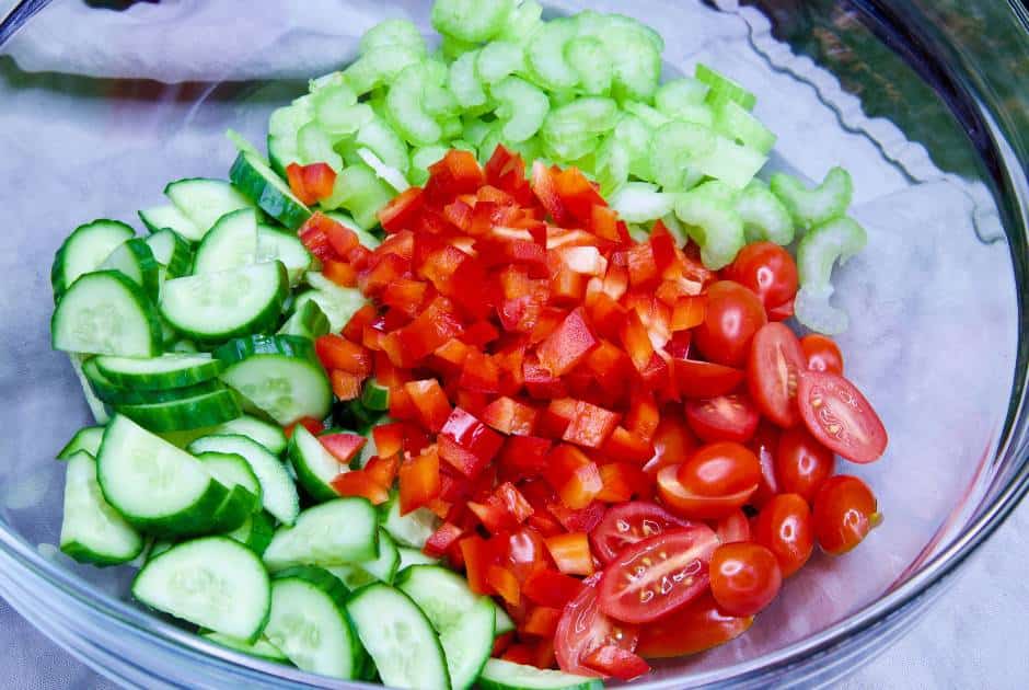 chopped-tomatoes-cucumbers-red-pepper-celery-in-glass-bowl