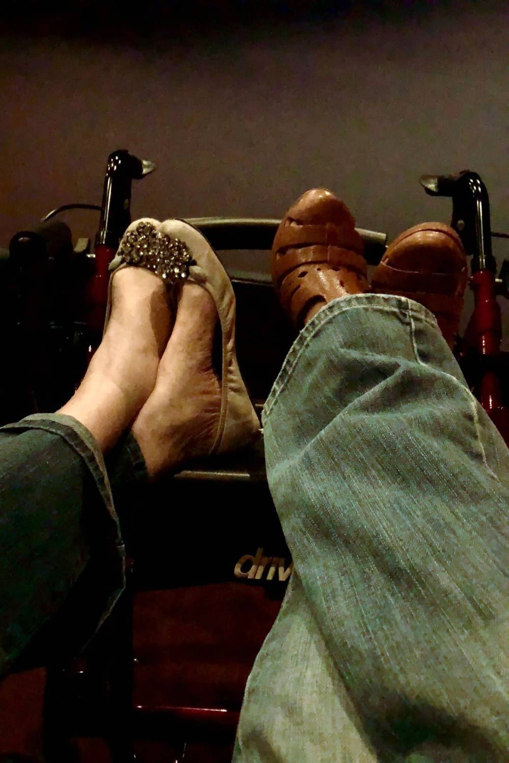 mother-daughter-legs-with-feet-crossed-propped-up-on-walker