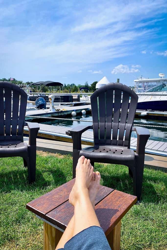 dawn's feet propped on a small table with a view of the harbor