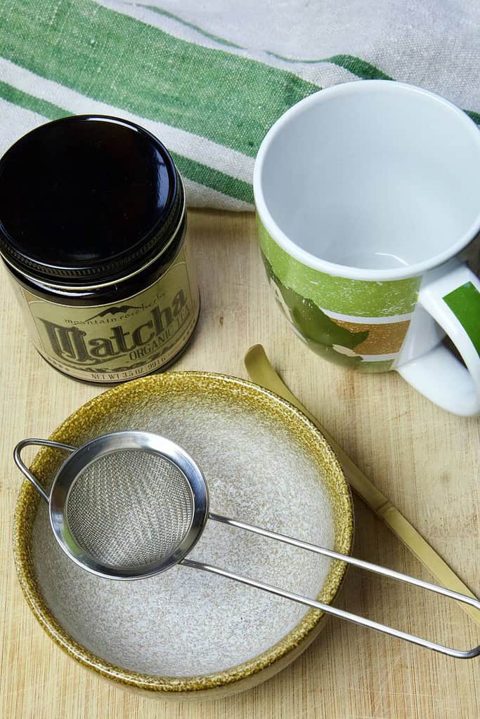 ingredients and tools to make matcha latte