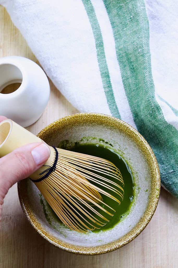 whisking matcha with water