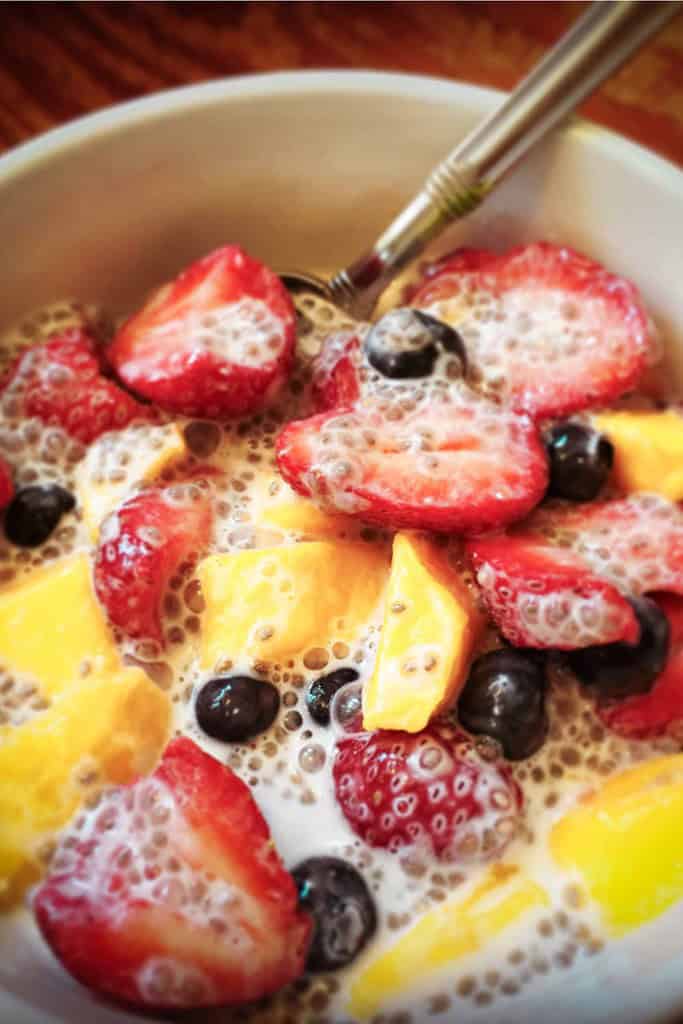 sliced strawberries and mango with chia seed pudding