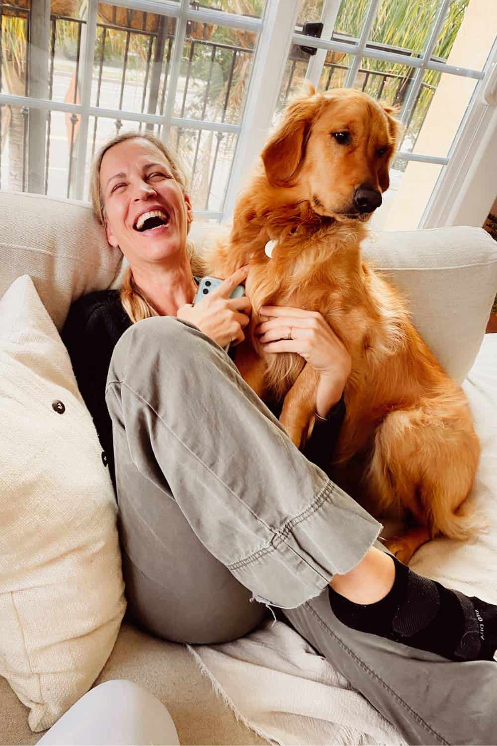 dawn laughing with a big dog on her lap