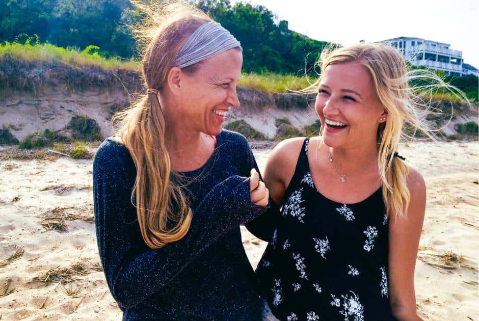 dawn and daughter laughing on the beach