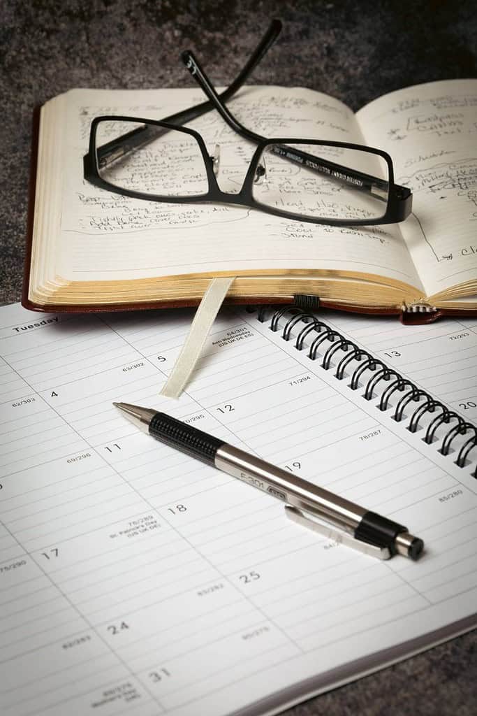 open calendar organizer glasses and pen for planning