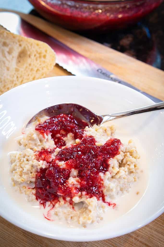 sugar free cranberry sauce on top of a bowl of oatmeal