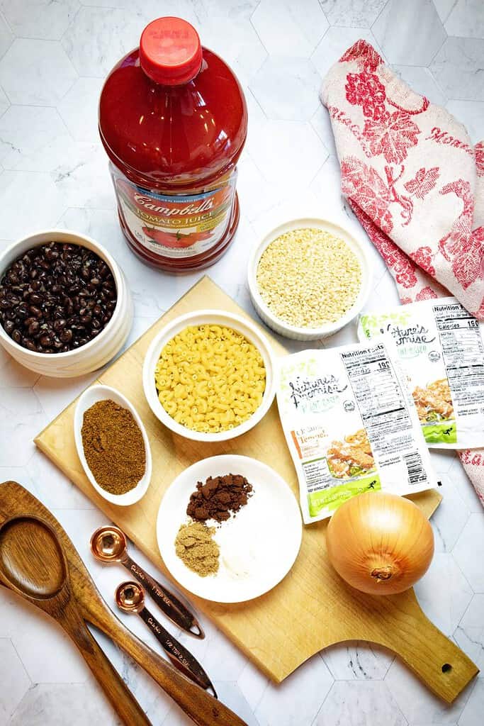 ingredients on the counter with a cutting board to make black bean vegan chili