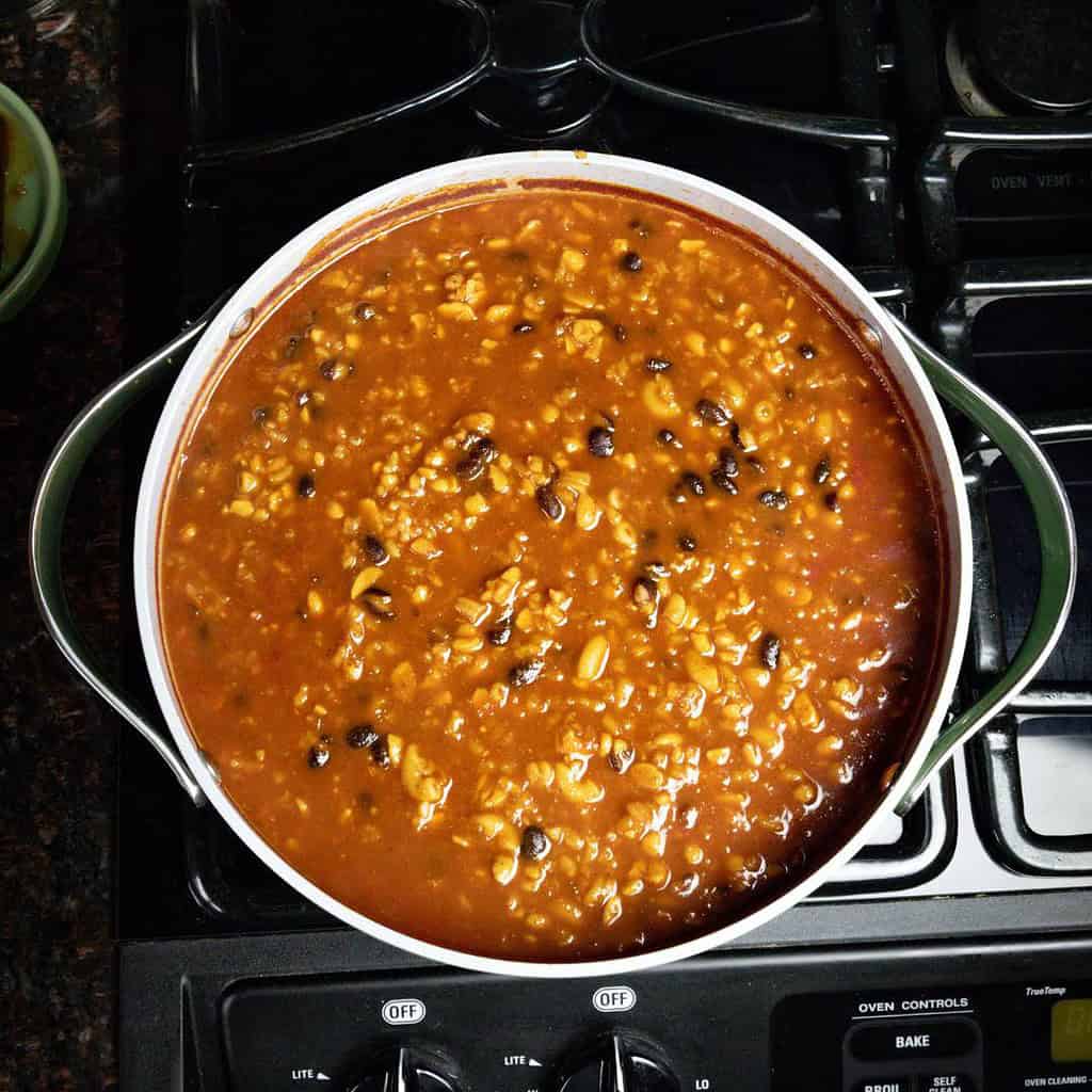 large soup pot on the stove with black bean vegan chili