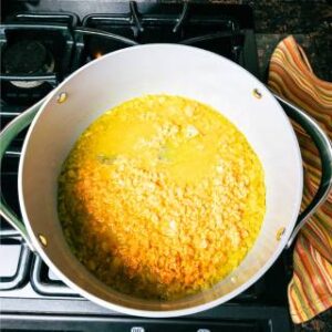 water spices and lentils in a large soup pot