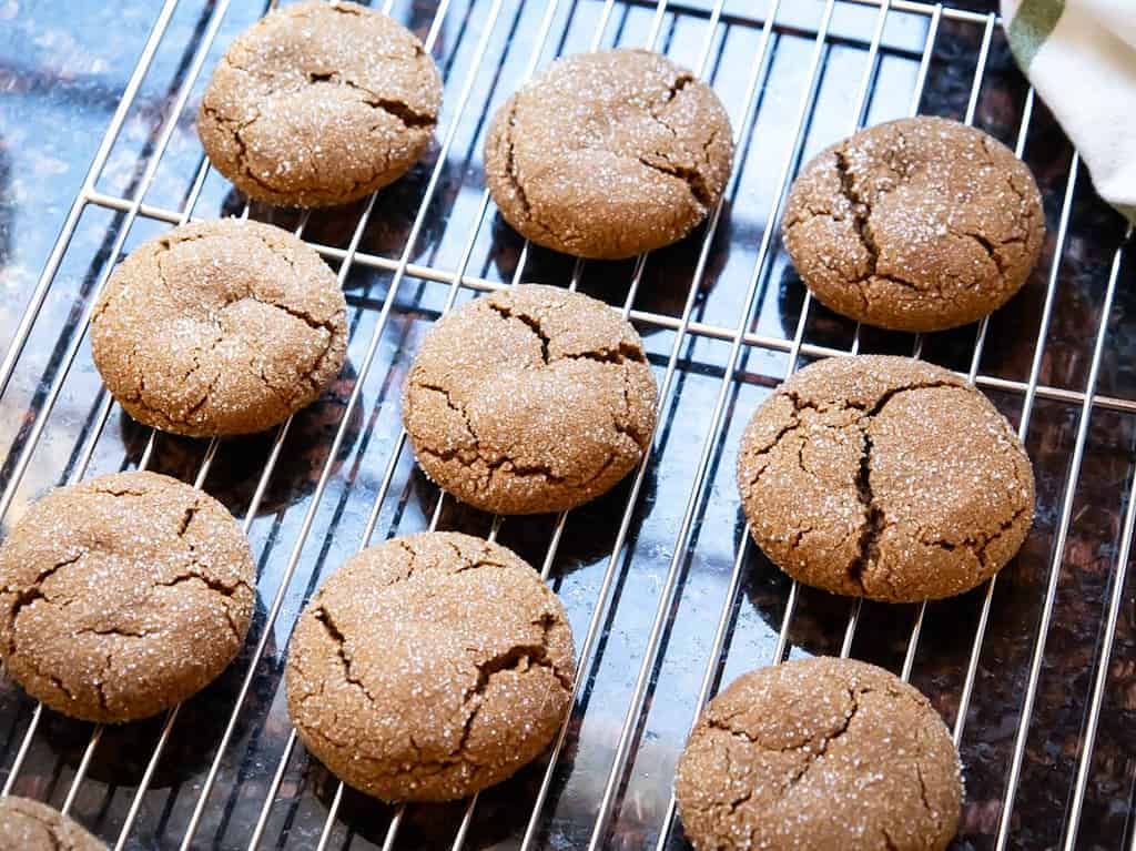 baked gingersnap cookies on a cooling rack