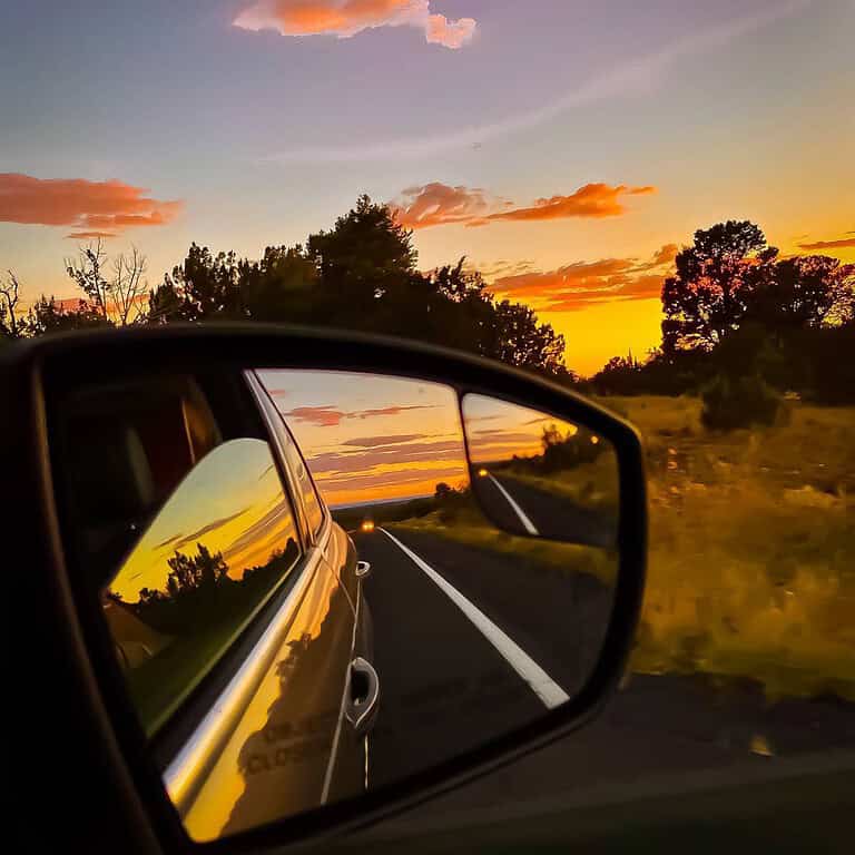 view of sunset through a passenger door window