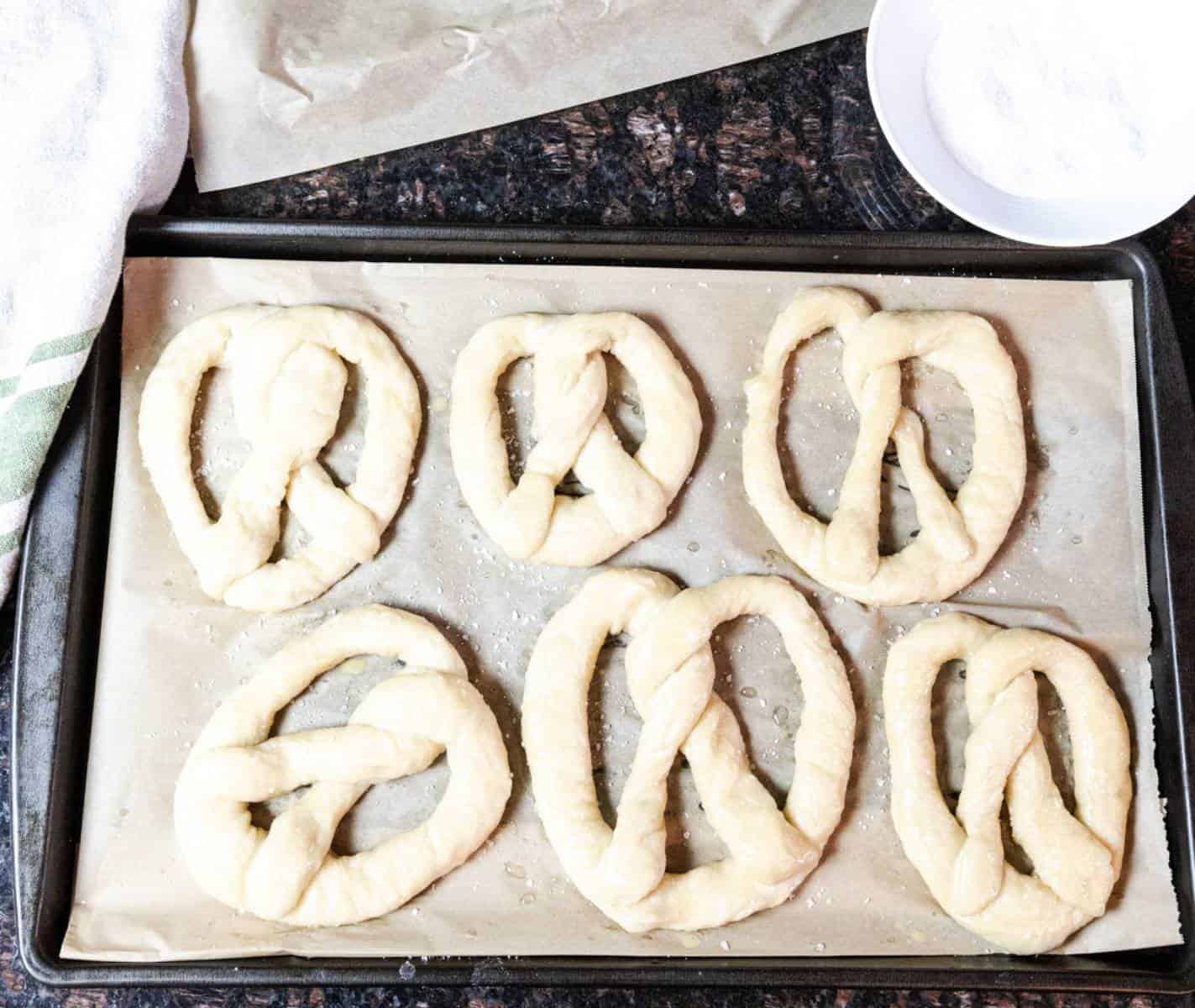 unbaked-soft-pretzels-on-a-baking-pan