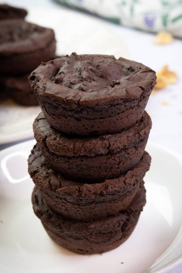 four vegan black bean brownies stacked on top of one another