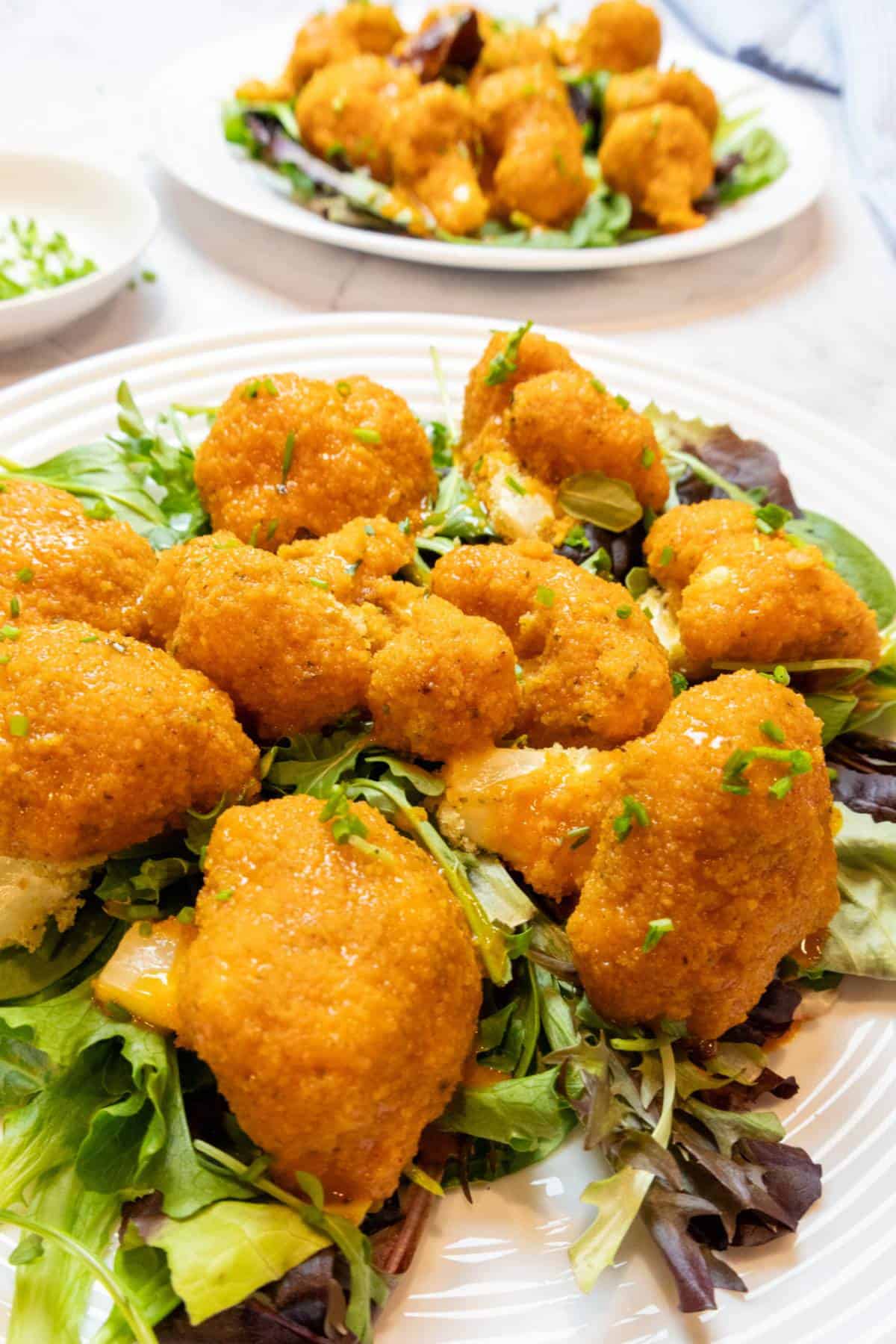 vegan-buffalo-wings-on-a-bed-of-lettuce