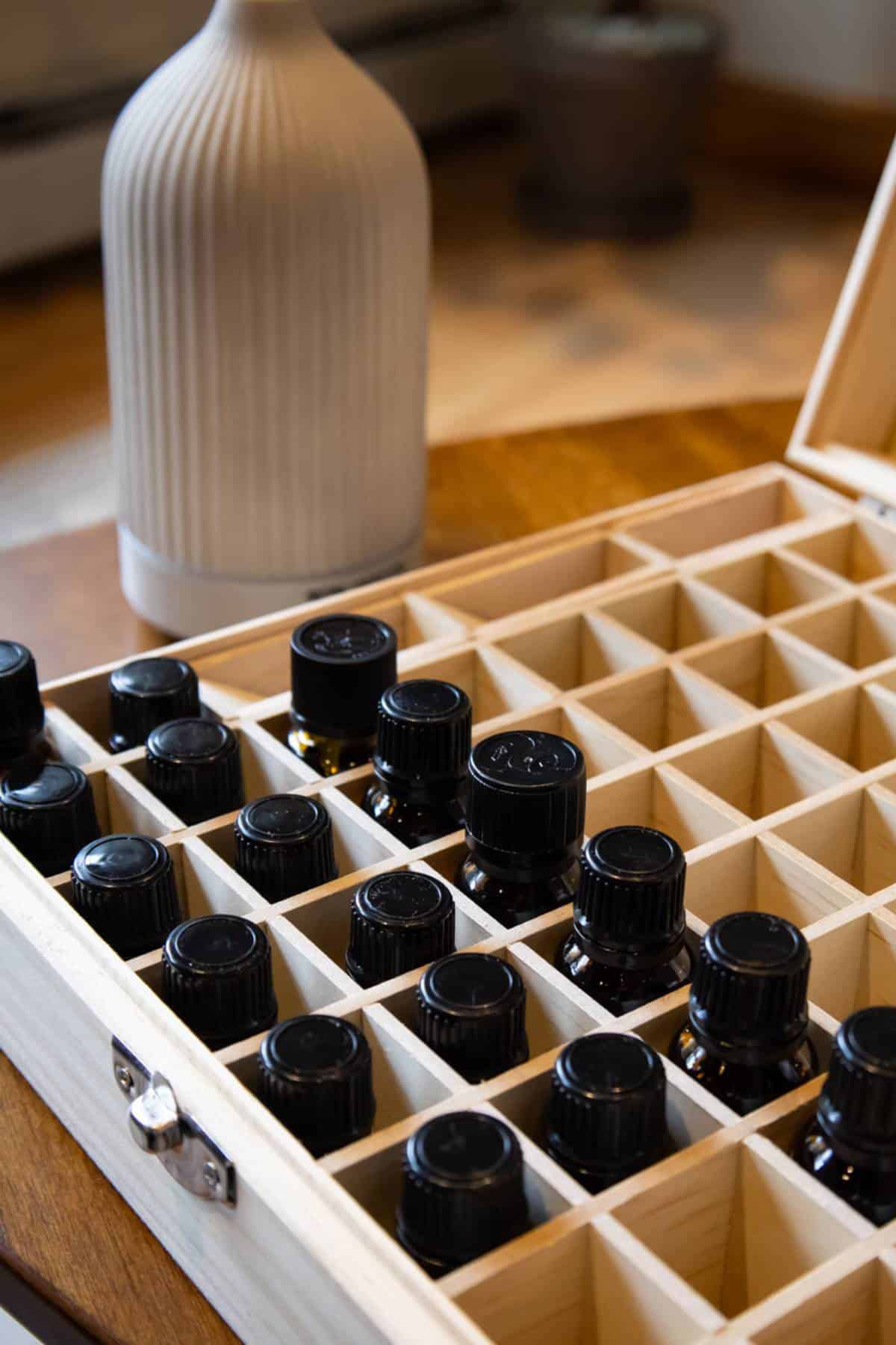 wooden-box-opened-with-bottles-of-essential-oils