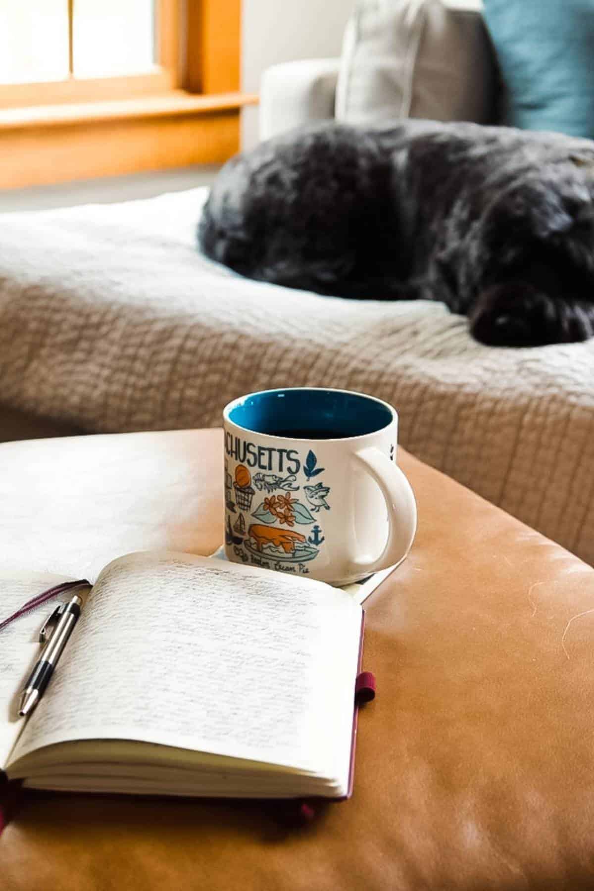 morning-routine-with-coffee-journal-sleeping-black-dog